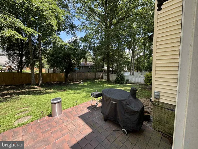 a view of a yard with furniture