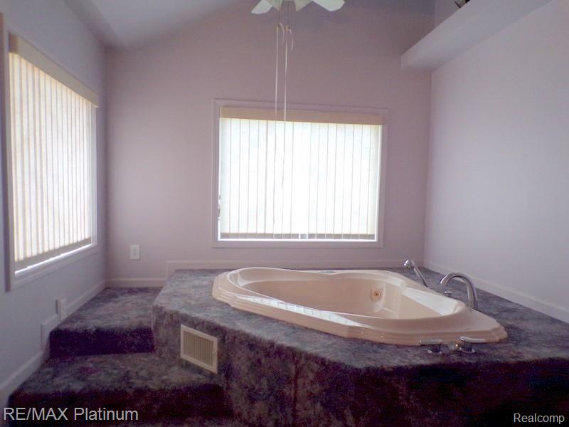 7933 North Fleming Road Fowlerville, MI 48836 - Photo 13 of 35 Jacuzzi Tub in the Main Floor Bathroom