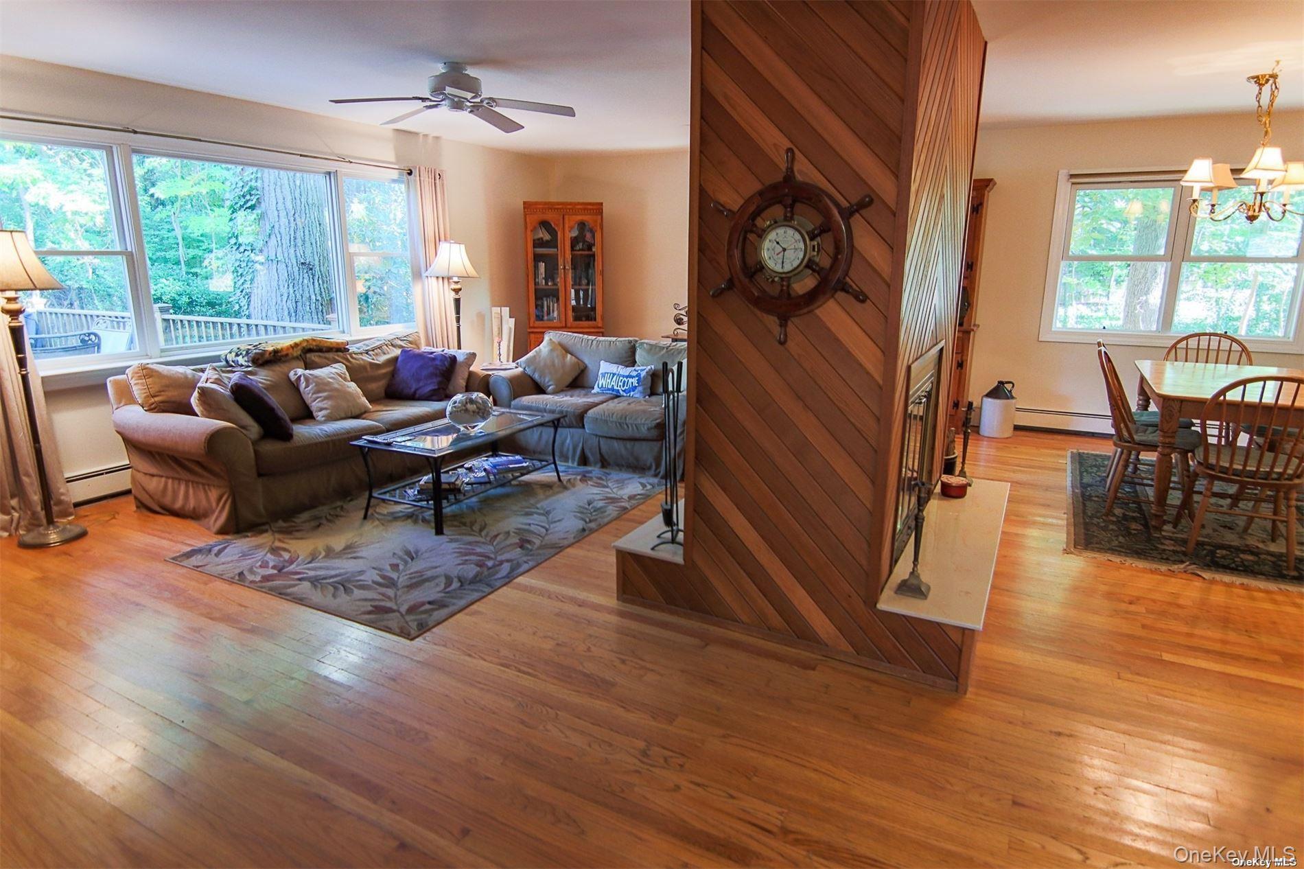 101 North Country Road Shoreham, NY 11786 - Photo 25 of 25 Open Floor plan with dual fireplace in living room and dining room