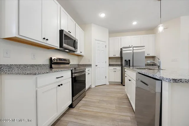 a view of a storage and utility room with closet