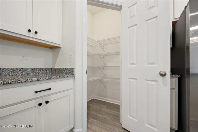 a kitchen with stainless steel appliances granite countertop a stove a refrigerator and a sink