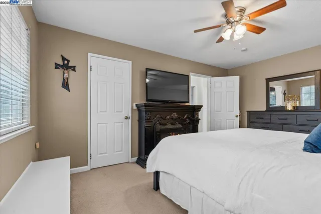 a bed room with a bed and a television