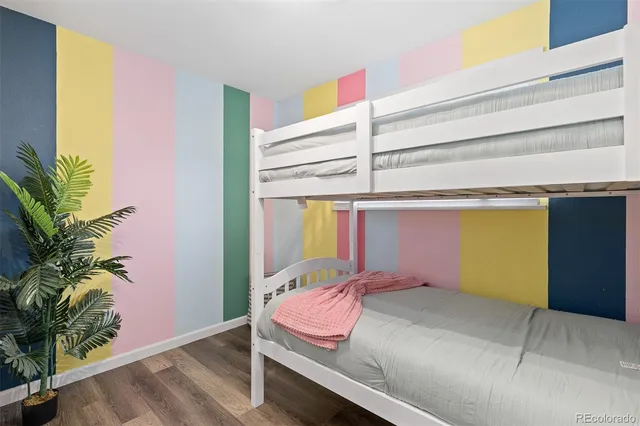 a bedroom with a bed and a potted plant