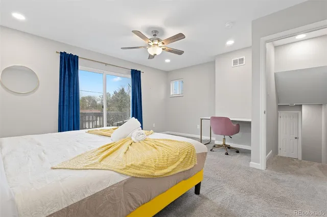 a bed sitting in a room next to a window