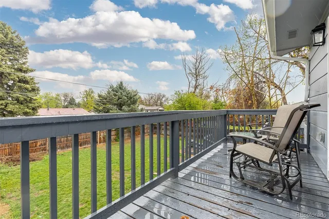 a view of a two chairs on the roof deck