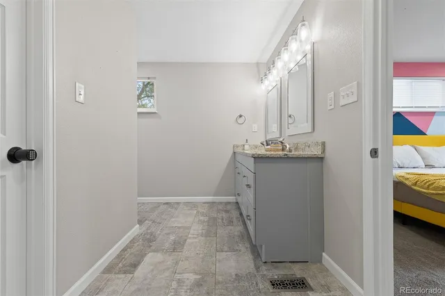 a bathroom with a sink and mirror
