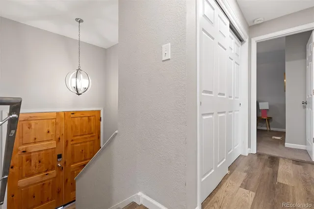 a view of an entryway with wooden floor
