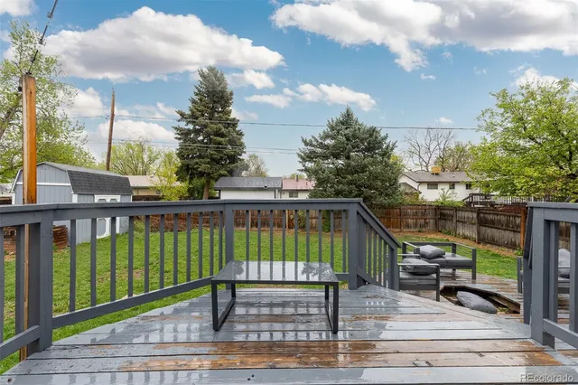 a view of a balcony with sitting area