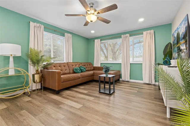 a living room with furniture and a large window