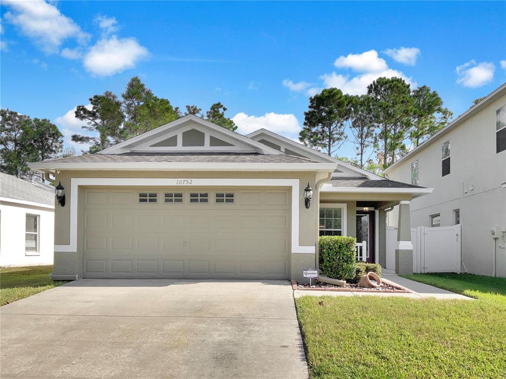 10752 Navigation Drive Riverview, FL 33579 - Photo 1 of 1 a front view of a house with garden