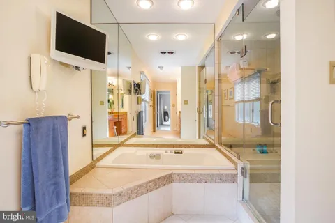 a view of a bathroom with a tub and a sink