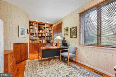 a workspace with furniture and a window