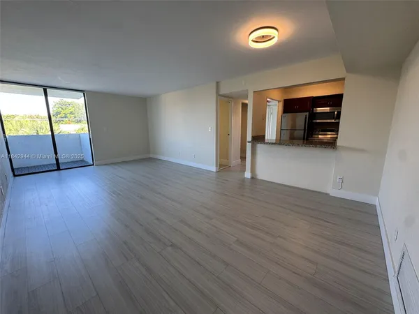 a view of a livingroom with wooden floor