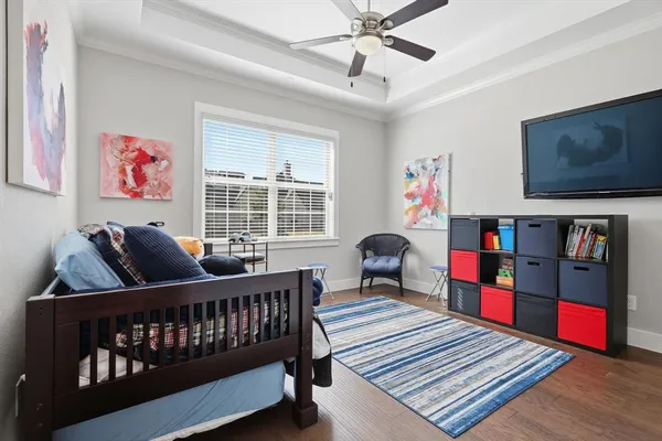 a bedroom with furniture and a window