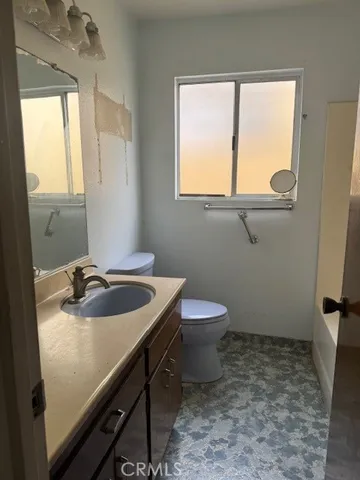 a stove top oven sitting inside of a kitchen