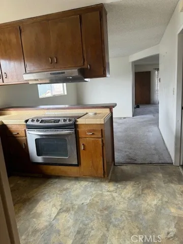 a view of empty room with a fireplace