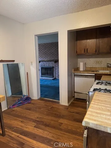 a view of staircase with wooden floor and a rug
