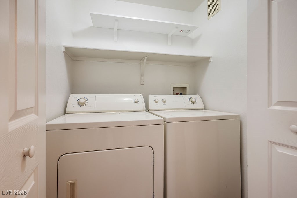 4655 Gold Dust Avenue, Unit 211 Las Vegas, NV 89120 - Photo 19 of 24 Laundry area with washer and dryer