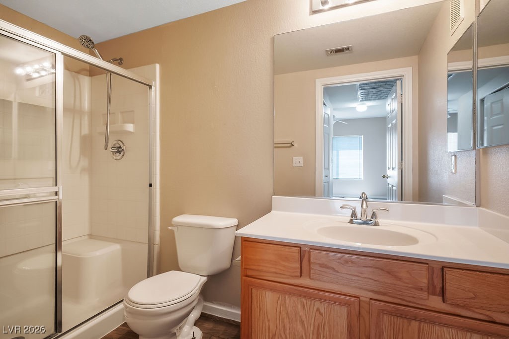 4655 Gold Dust Avenue, Unit 211 Las Vegas, NV 89120 - Photo 20 of 24 Full bathroom featuring vanity and a stall shower