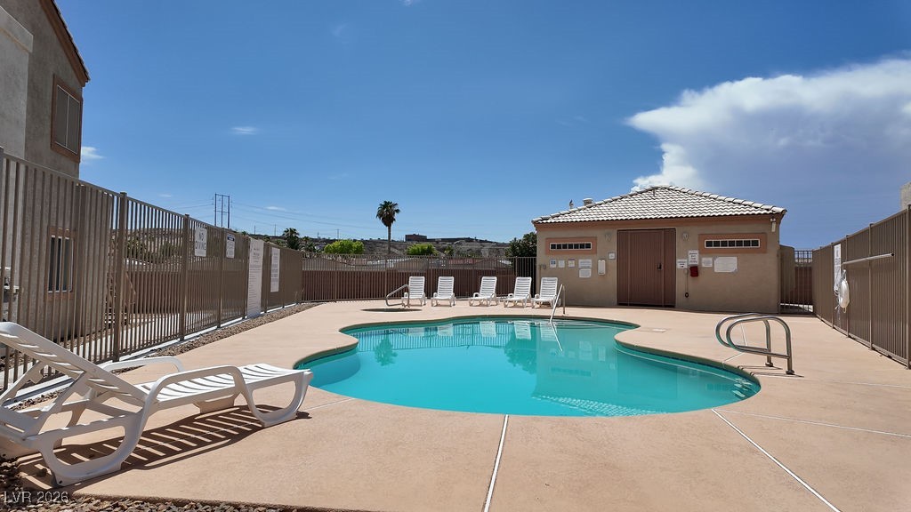 4655 Gold Dust Avenue, Unit 211 Las Vegas, NV 89120 - Photo 22 of 24 Community pool featuring a patio area