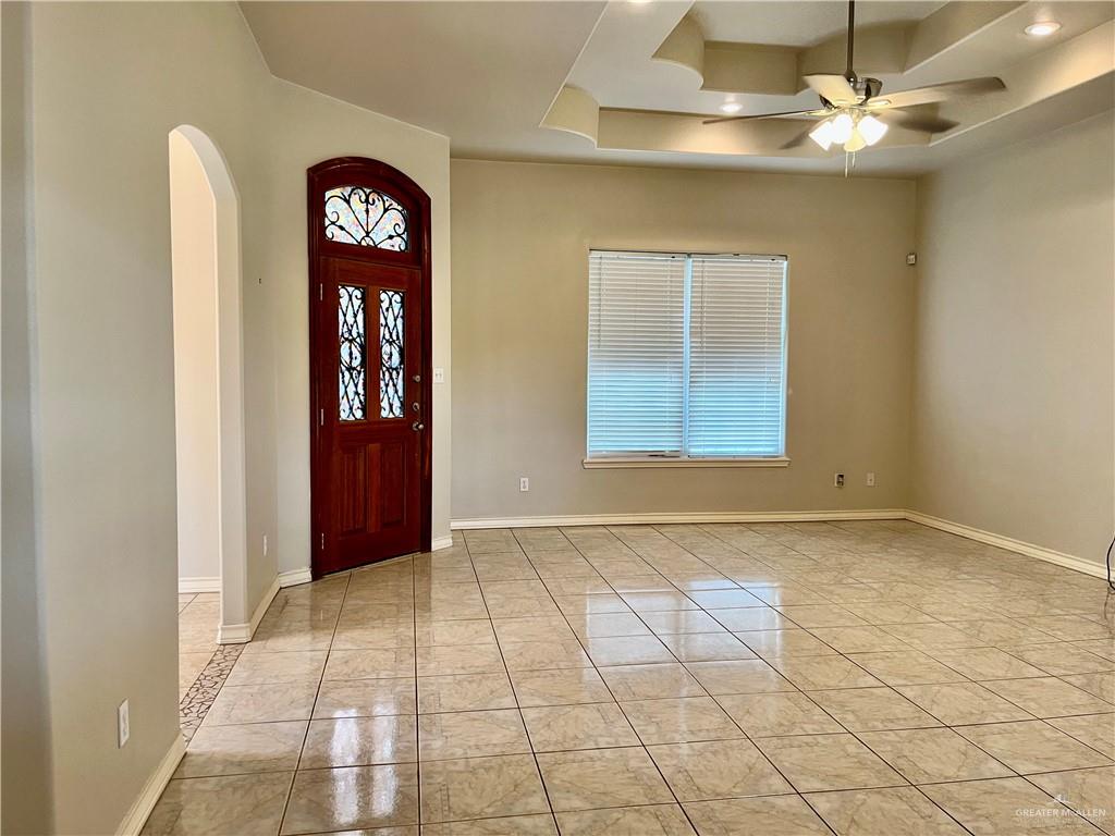 20724 North Fm 493 Road Edinburg, TX 78542 - Photo 2 of 29 Front Door Entrance foyer featuring arched walkways, a ceiling fan, and baseboards