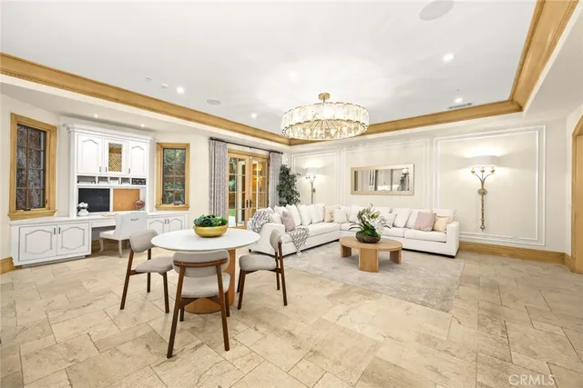 a kitchen with stainless steel appliances kitchen island granite countertop a stove a sink and a refrigerator