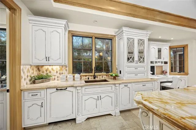 a view of hallway with wooden floor and cabinets
