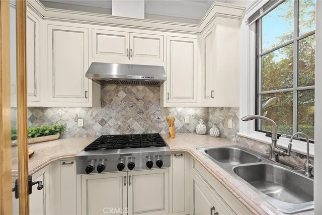 a bathroom with a tub a sink and a mirror