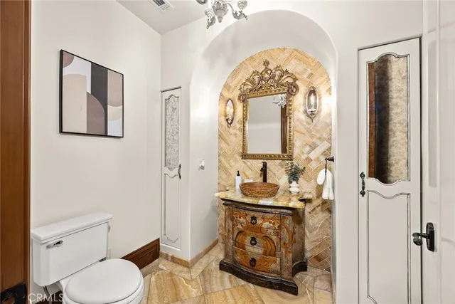 a spacious bedroom with a bed and ceiling fan