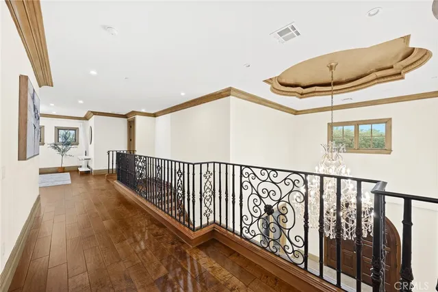 a spacious bedroom with a large bed and a tv