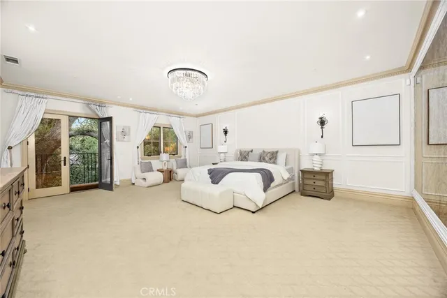 a bathroom with a tub shower sink and mirror