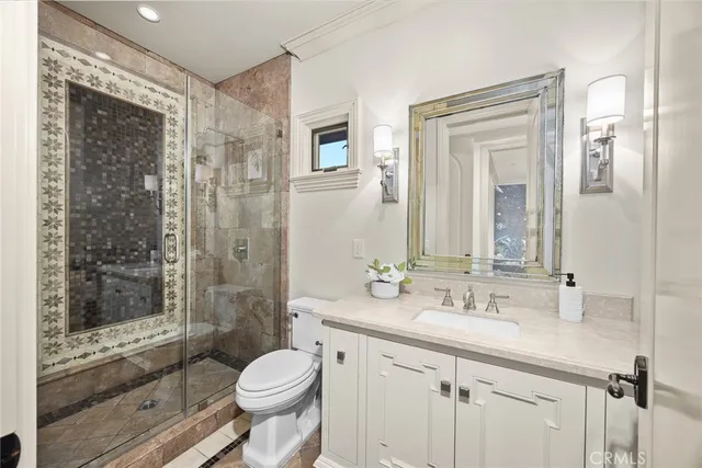 a front view of a house with garden and trees