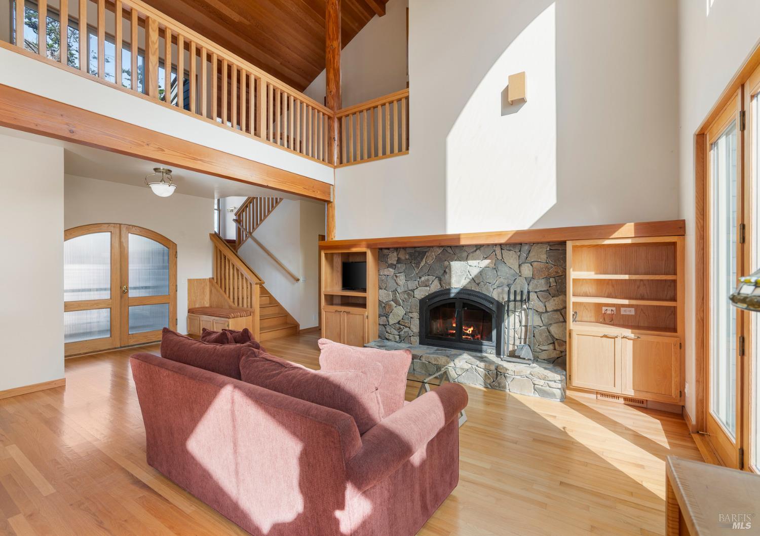 116 Shepherds Close The Sea Ranch, CA 95497 - Photo 14 of 65 a living room with furniture and a fireplace