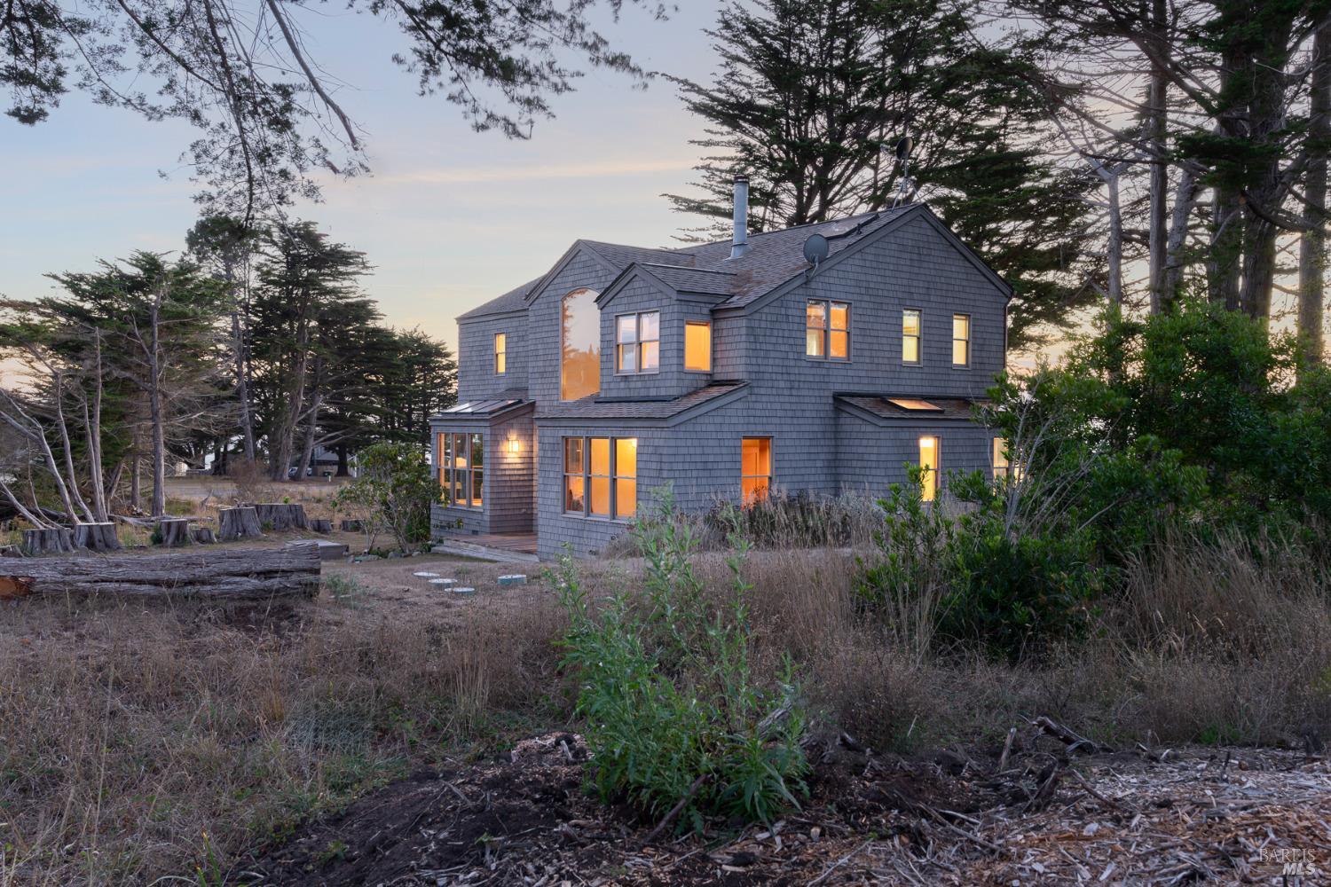 116 Shepherds Close The Sea Ranch, CA 95497 - Photo 58 of 65 a front view of a house with yard and green space