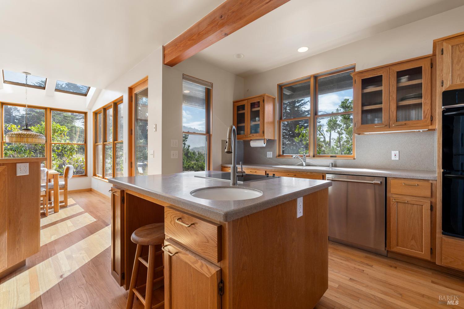 116 Shepherds Close The Sea Ranch, CA 95497 - Photo 9 of 65 a kitchen with a sink and wooden cabinets