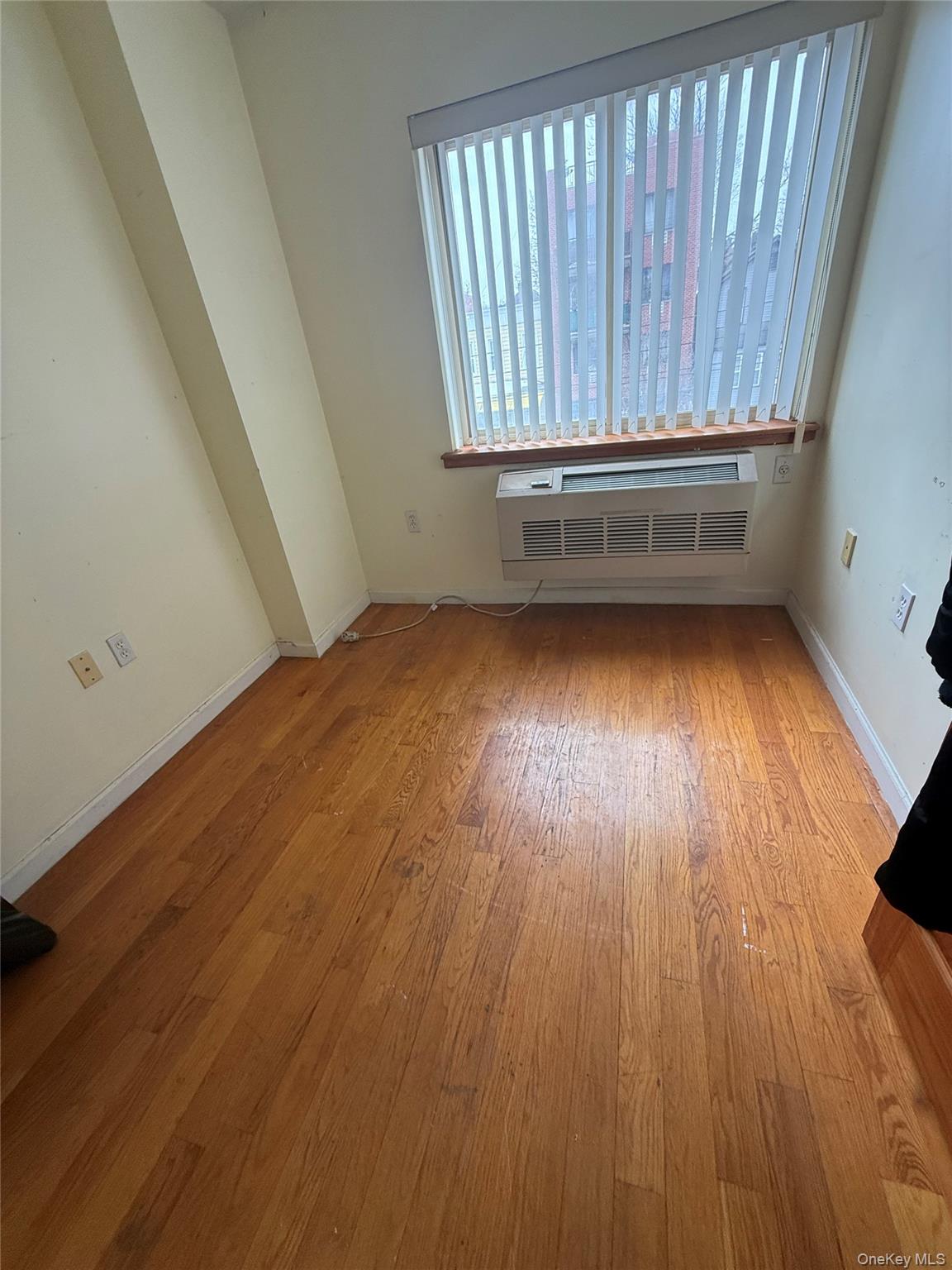 112-31 38th Avenue, Unit 3D Queens, NY 11368 - Photo 5 of 8 a view of entryway with wooden floor