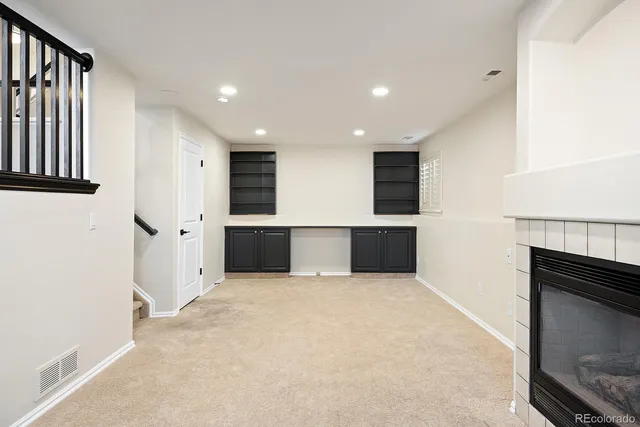 a view of kitchen with refrigerator and window