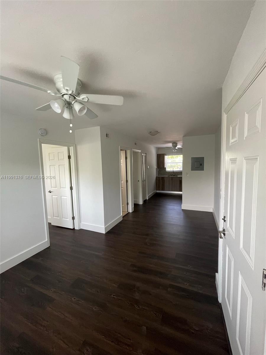1864 Northwest 24th Street, Unit 4 Miami, FL 33142 - Photo 4 of 6 wooden floor in an empty room with a window