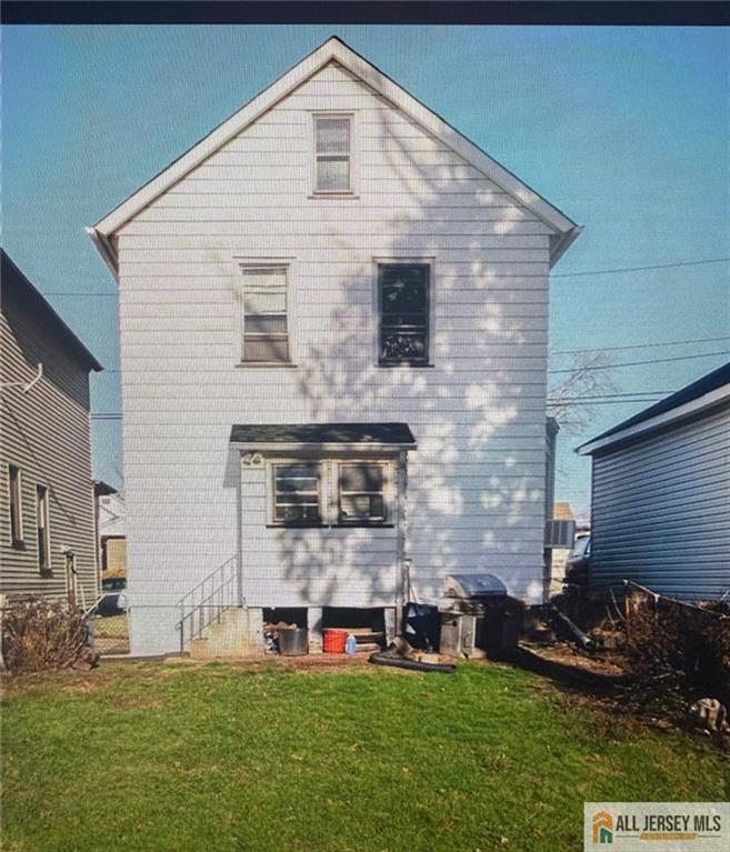 52 Ellen Street New Brunswick, NJ 08901 - Photo 5 of 5 a front view of a house with a yard
