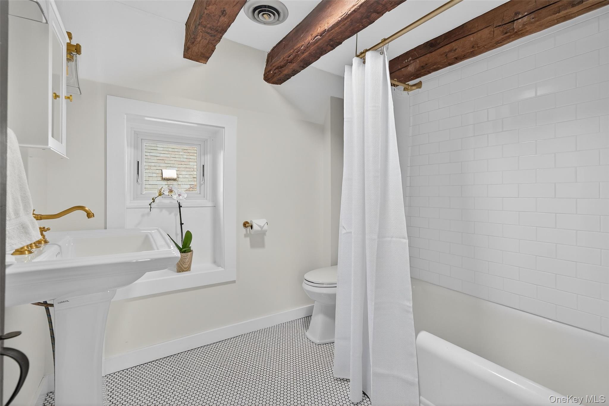 441 Scotchtown Collabar Road Middletown, NY 10941 - Photo 35 of 48 Full bathroom featuring beam ceiling, shower / bathtub combination with curtain, and tile patterned floors