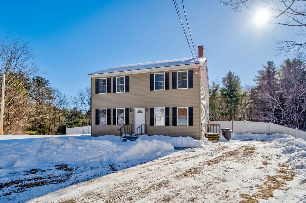 40 Sawyer Street Gardner, MA 01440 - Photo 1 of 37 a front view of a house with a yard