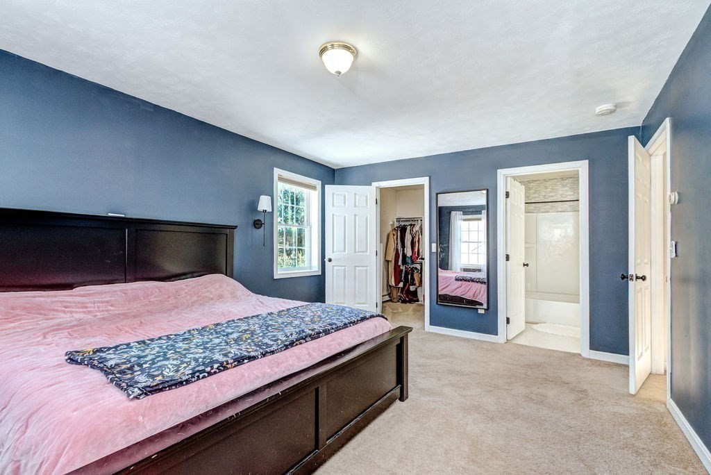 40 Sawyer Street Gardner, MA 01440 - Photo 20 of 37 a bedroom with a bed and a large mirror on dresser