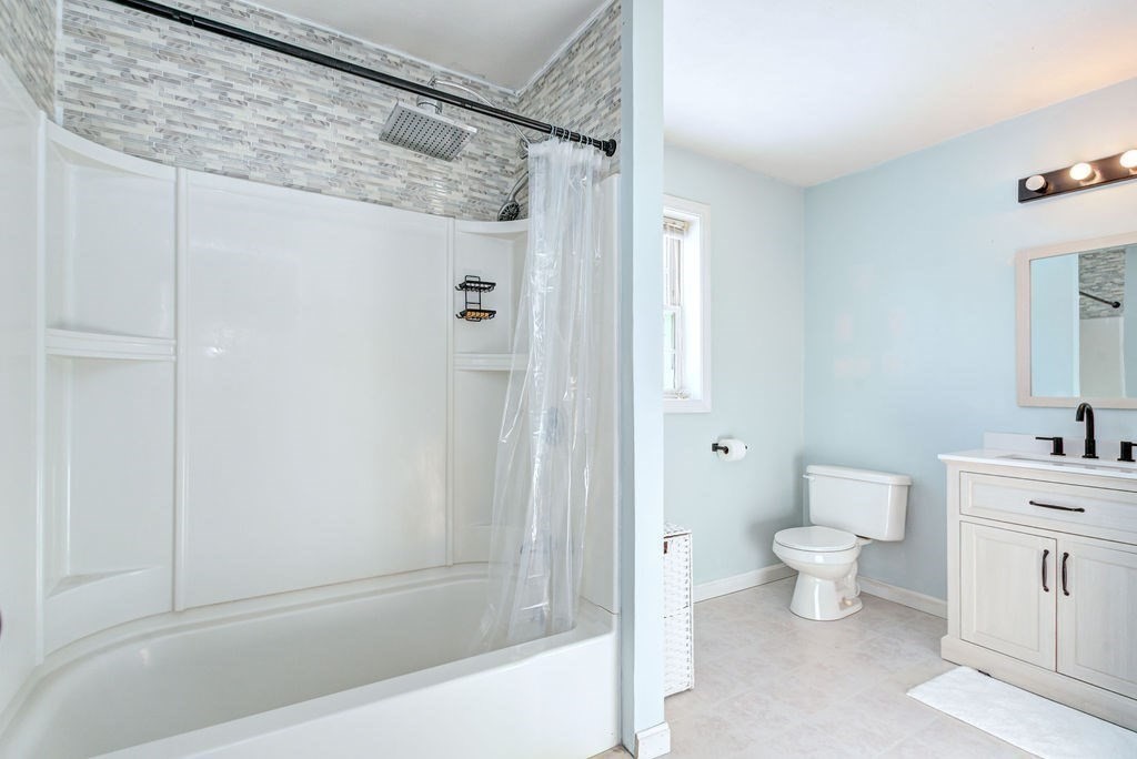 40 Sawyer Street Gardner, MA 01440 - Photo 22 of 37 a bathroom with a toilet a sink and shower