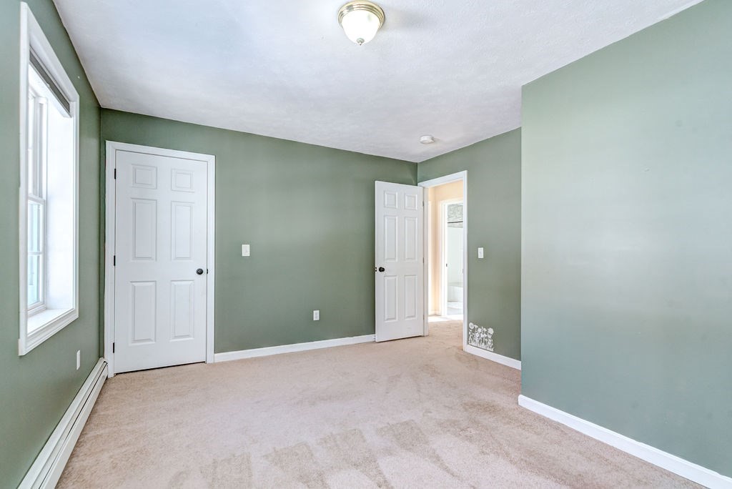 40 Sawyer Street Gardner, MA 01440 - Photo 28 of 37 a view of an empty room with window and closet area