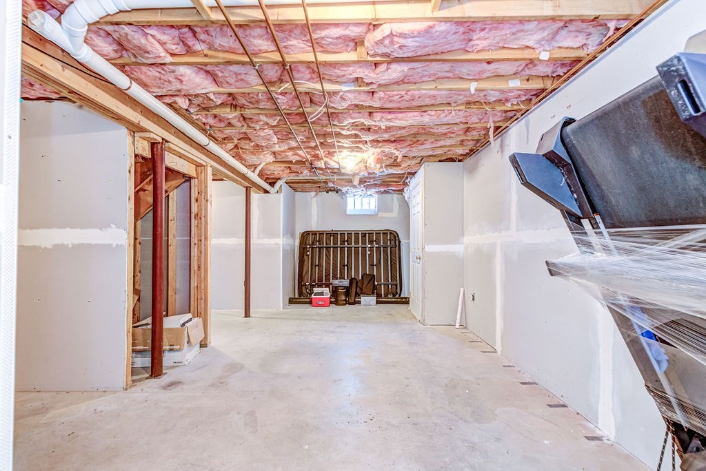 40 Sawyer Street Gardner, MA 01440 - Photo 30 of 37 a view of a hallway with stairs and a chandelier