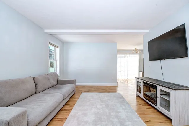 a living room with a flat screen tv and a couch