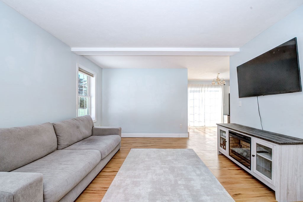 40 Sawyer Street Gardner, MA 01440 - Photo 6 of 37 a living room with a flat screen tv and a couch