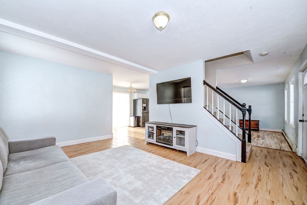 40 Sawyer Street Gardner, MA 01440 - Photo 7 of 37 a view of a livingroom with wooden floor and furniture
