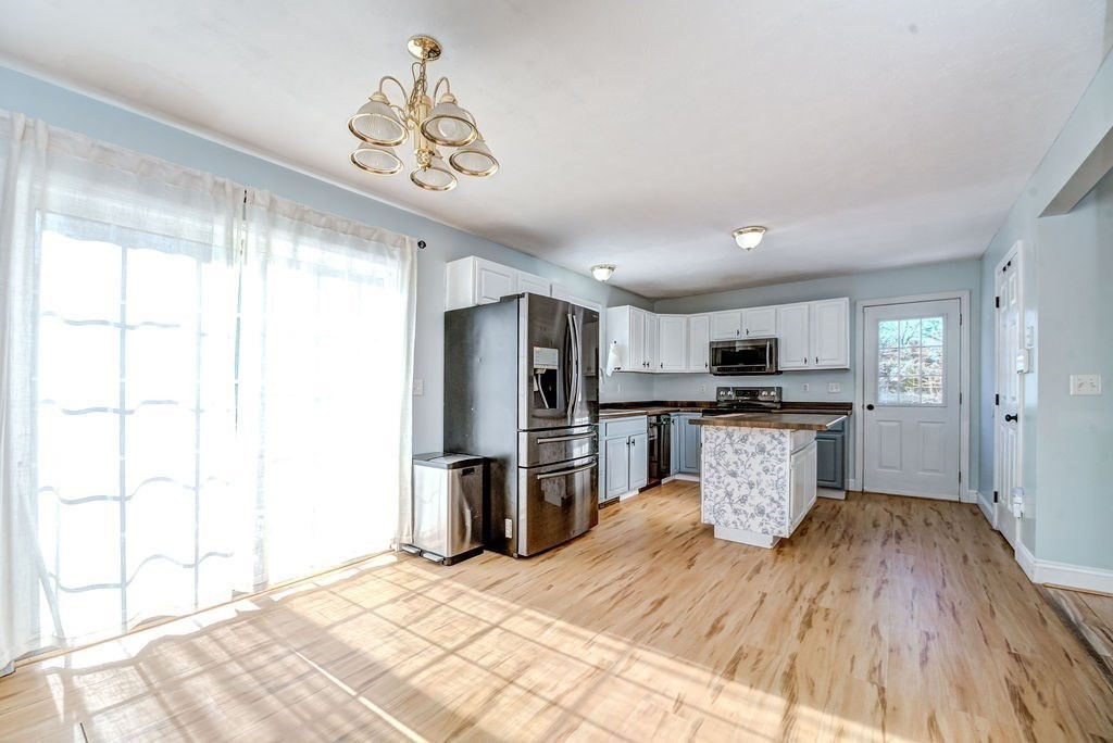 40 Sawyer Street Gardner, MA 01440 - Photo 8 of 37 a kitchen with a refrigerator and a sink