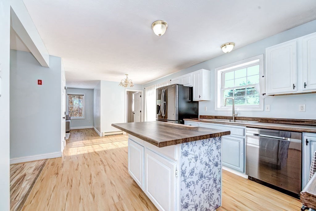 40 Sawyer Street Gardner, MA 01440 - Photo 10 of 37 a kitchen with stainless steel appliances granite countertop a sink stove and refrigerator